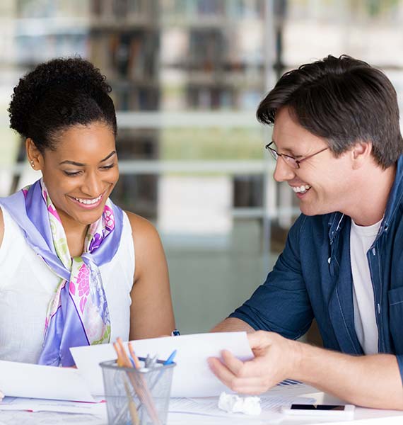 Two people looking at paperwork