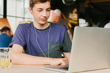 Youth working on laptop