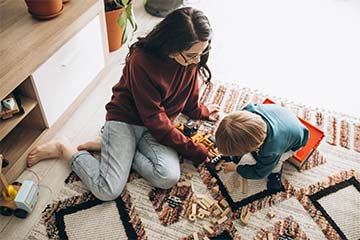 Young teen and small child playing