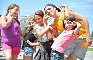 Young kids with camp staff in the summer