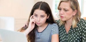 Mom and daughter discussing cyber bullying