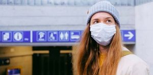 Teenage girl wearing a mask