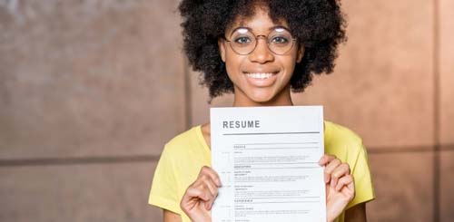 Young woman holding resume
