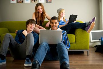 group of youth looking at computer screen