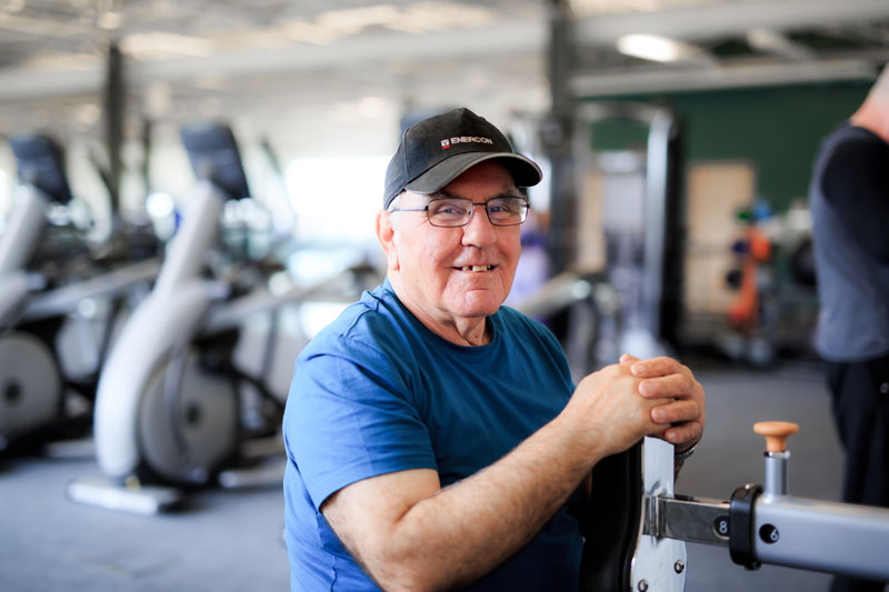 Older Man on weight machine