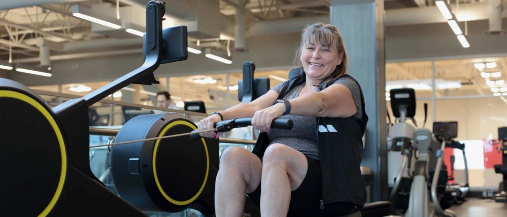 Woman on rowing machine