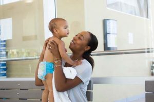 Mom holding infant son at YMCA