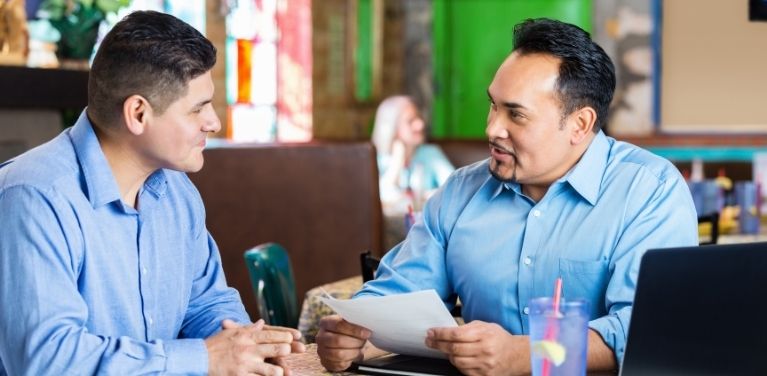 Two men talking during job interview