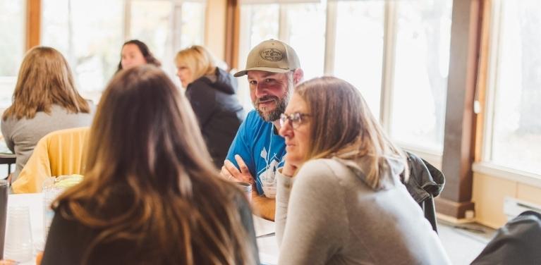 Group of people learning how to network to find employment